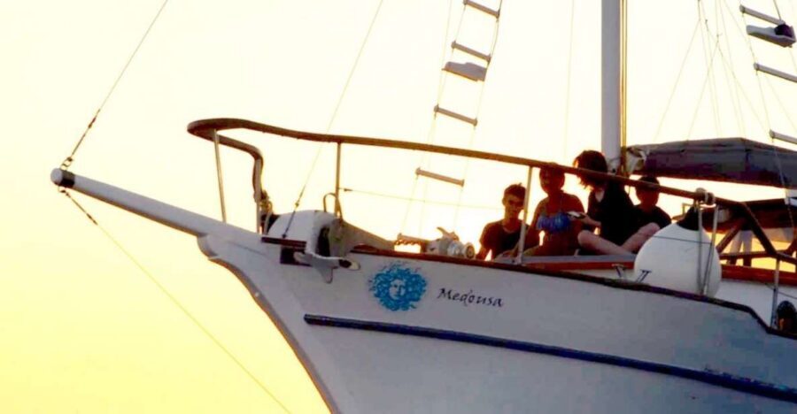 Santorini: Traditional Wooden Boat Tour with Meal and Wine - Sunset option in reverse, plus logistics and value for $94