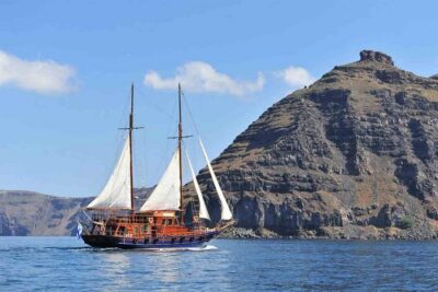 Santorini Volcanic Sunset Cruise - Oia at sunset, seen from the sea