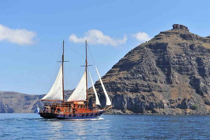 Santorini Volcanic Sunset Cruise - Oia at sunset, seen from the sea