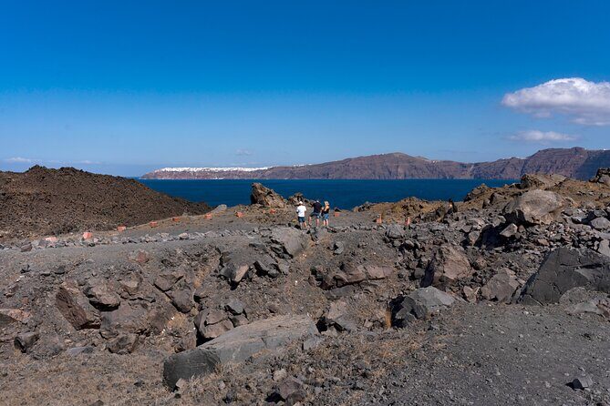 Santorini - Volcano and Hot springs Boat Trip with Bus Transfer - Stop 1: Santorini volcano at Erinia Bay and the crater-area walk