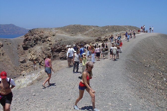 Santorini - Volcano and Hot springs Boat Trip with Bus Transfer - Stop 2: Nea Kameni hot springs swim at 30–35°C
