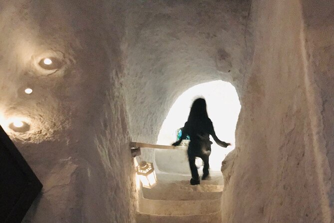 Santorini wine tasting and Traditional Cave Settlement Tour - Stop one: tasting wines grown in volcanic soil