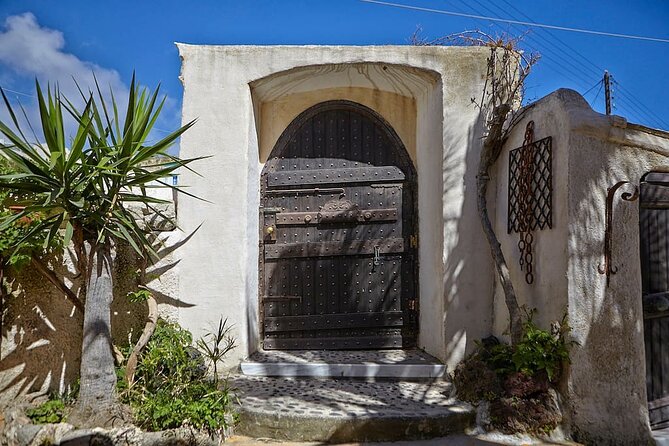 Santorini wine tasting and Traditional Cave Settlement Tour - Stop two: a cave settlement and secluded church