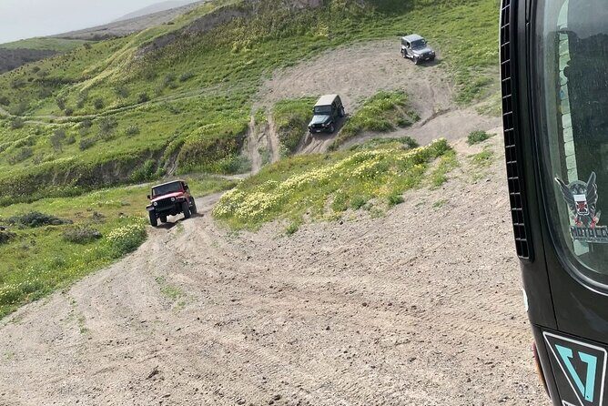 Santorini Wrangler Jeep Afternoon Convoy Tour - Passing older villages, the Akrotiri lighthouse area, and Megalochori dinner