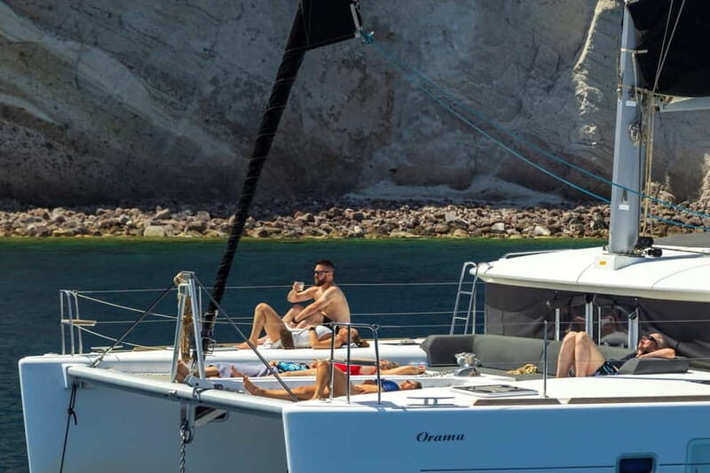 Santorini:All-inclusive Catamaran Cruise with Thirassia Stop - Red Beach and White Beach: the two shoreline stops you’ll actually remember