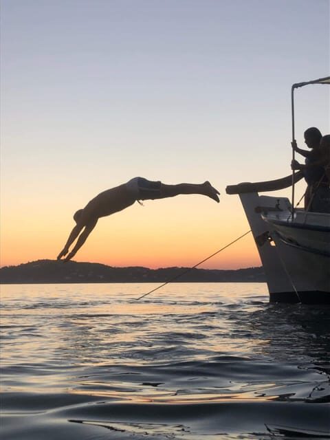 Skiathos: Boat Cruise with Dinner & Sunset Viewing - Sunset at sea: dinner, wine, beer, and liqueur mastic