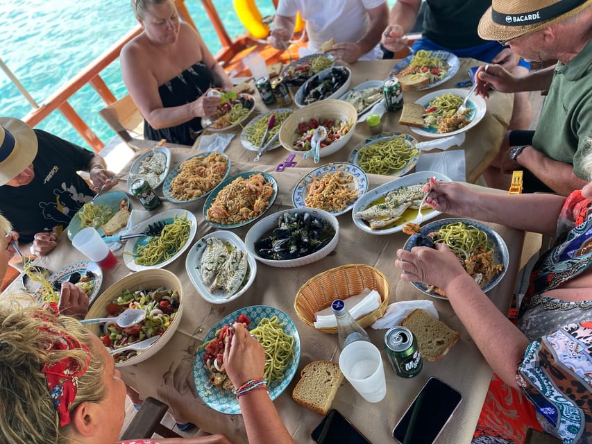 Skiathos: Traditional Boat Cruise with Swim Stops & Lunch - Sailing away from Skiathos