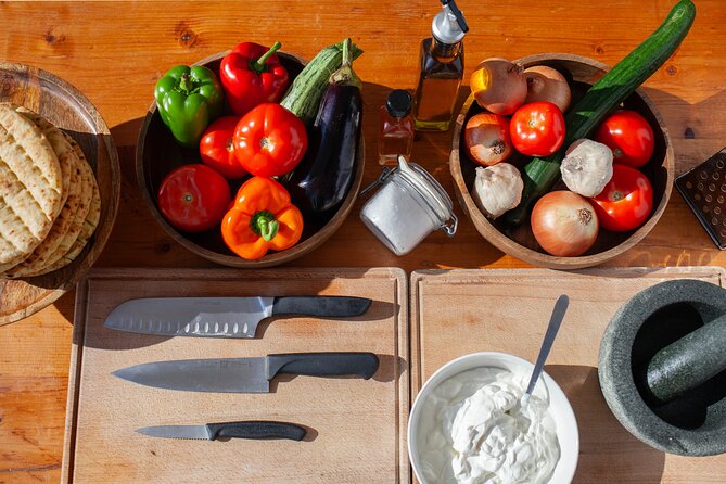 Souvlaki Cooking Class with Locals – Transfer Included - Preparing tzatziki from local ingredients