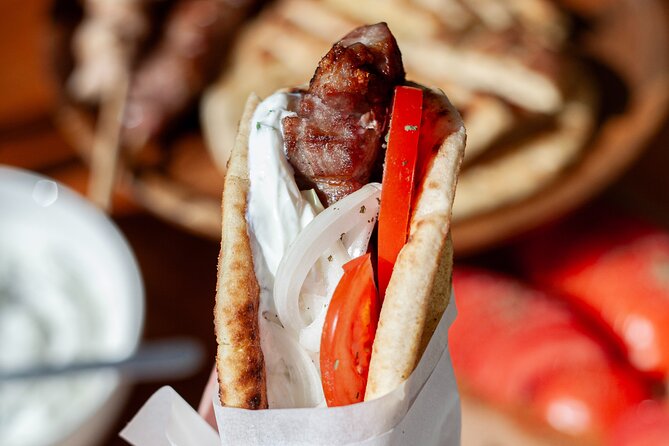 Souvlaki Cooking Class with Locals – Transfer Included - Folding pita and eating what you made
