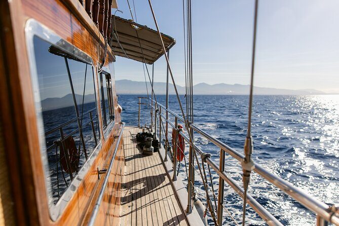 Sunset Dinner Cruise: Sunset, Swim, Drinks, and Dinner Onboard - Stop-by-stop: Athens, the Riviera cruise stretch, Ydrousa, and Vouliagmeni