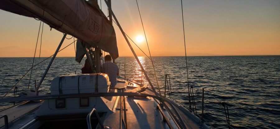 Thessaloniki Sunset Cruise departing from Nea Michaniona - Golden hour payoff: sunset on the horizon and the quiet beauty of sailing