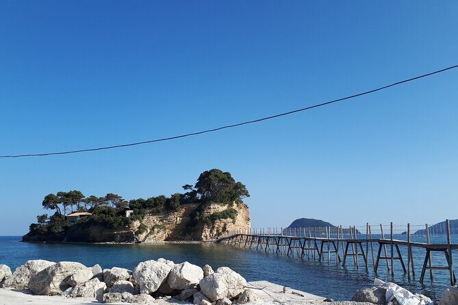 Zakynthos Half Day swimming tour to Turtle island and keri caves - Cameo Island stop: a quick photo break and a wooden-bridge moment