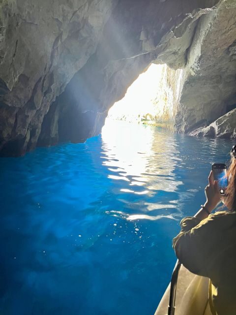 Zante: Half-Day Tour to Navagio, Blue Caves & White Beach - Blue Caves boat cruise and swims: what the cave riding feels like